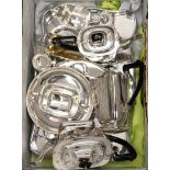 A box containing a collection of silver plated ware, including a five piece tea and coffee pot,