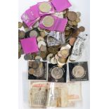 A bag of coins with a silver music medal and World War One War Medal,