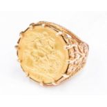 Full Sovereign gold coin ring in 9ct gold mount,