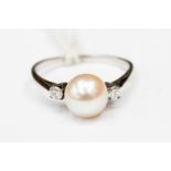 Fresh water cultured pearl and diamond ring approx pearl size 7mm on a white metal band size M 1/2