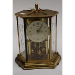 An Anniversary clock presented 1971 'Kundo' brass and glass panels that two of,