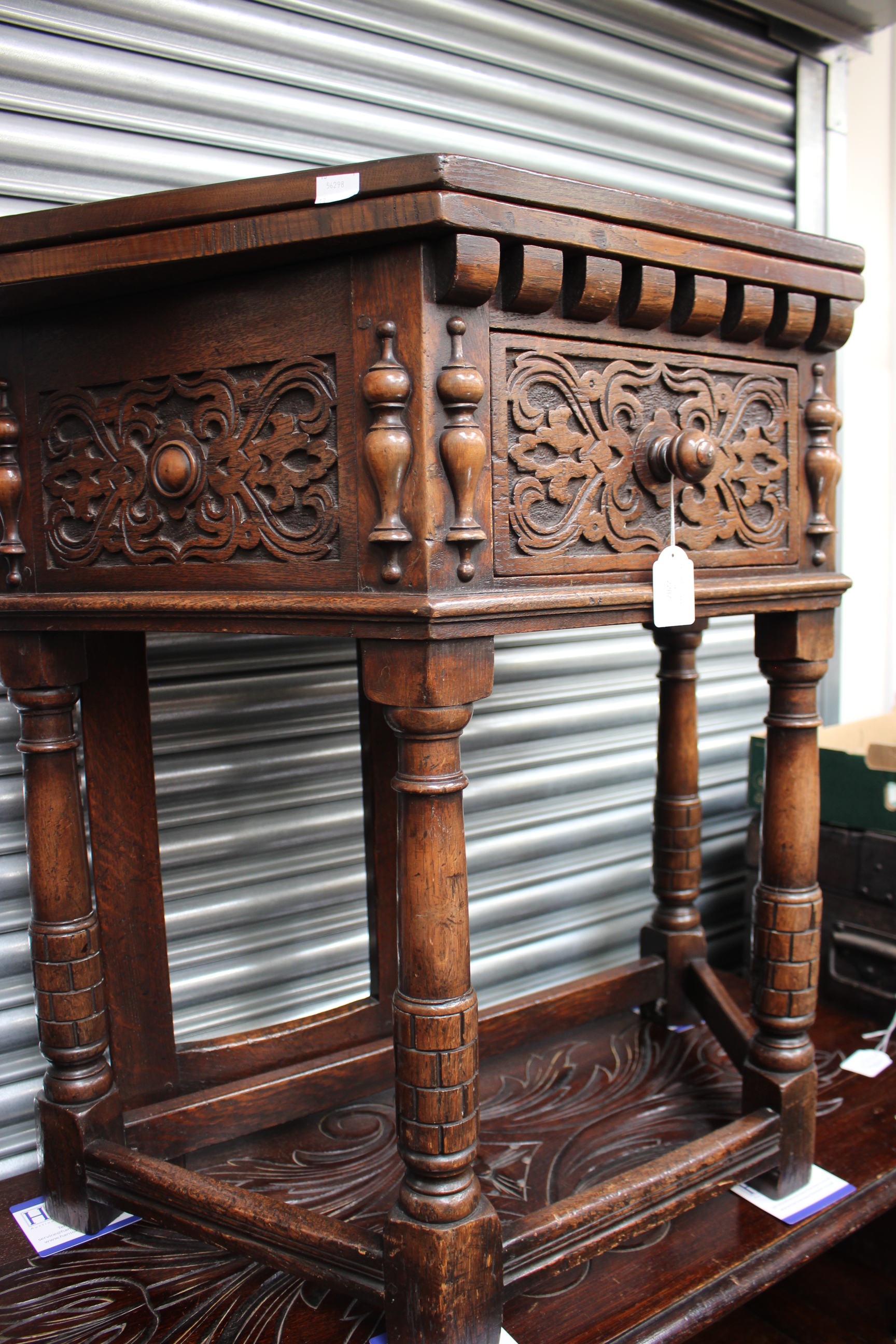 A Jacobean style table, oak joined Credence table with a folding top,