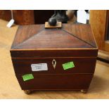 A mid 19th century tea caddy in mahogany