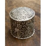 A silver embossed trinket pot and cover, Chester 1898, weighing approx 3.