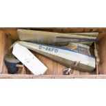 A cased model plane, in parts for storage,
