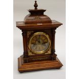 A bracket clock/table clock, fillials, and key within, brass dial, late 19th,