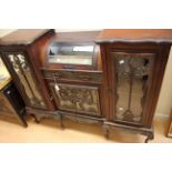 A late Victorian mahogany display cabinet, fitted with glazed doors,