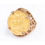 Full Sovereign gold coin ring in 9ct gold mount,