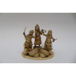 An Indian ivory carved group, depicting children playing instruments, circular base,