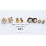 A collection of earrings including 18ct gold, 9ct and opal,