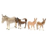 Four Beswick donkeys (one a/f)