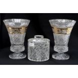 A pair of heavy cut glass vases,