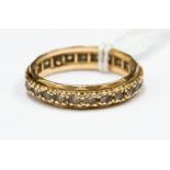 A 9ct gold white stone eternity ring, one stone missing, ring size T, 2.