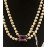 A double strand pearl necklace with amethyst and diamond set 18ct.