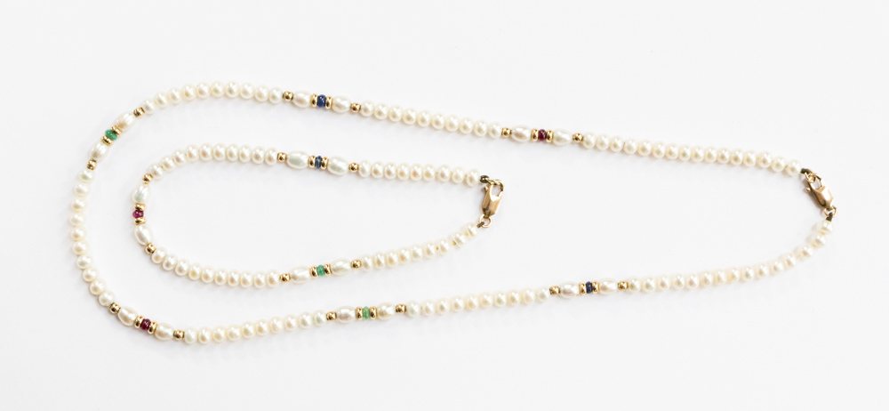 A pearl and 9ct gold necklace and bracelet