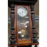 A late 19th Century walnut Vienna wall clock