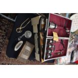 A cased trowel bar, Ronson lighter, cigarette box, match striker and cork puller,
