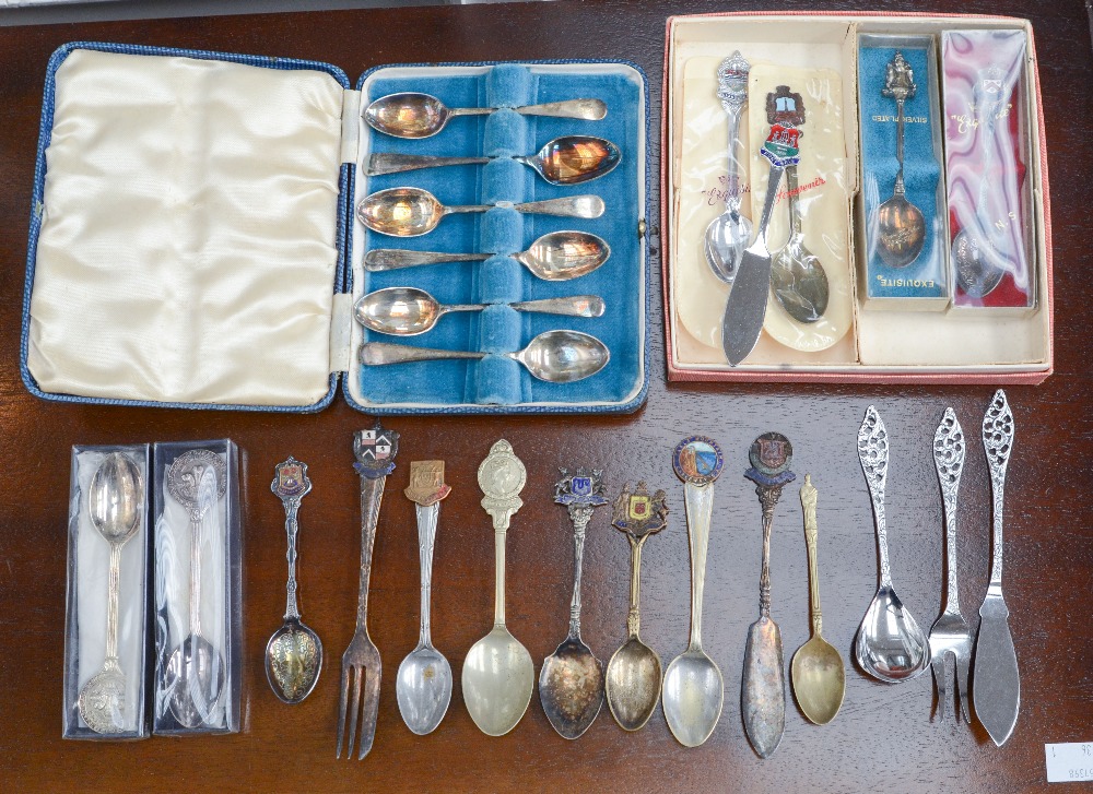 A collection of decorative spoons etc