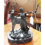 A bronze figure, possibly a modernist version of 'Diana' with a stag on a pebble effect,