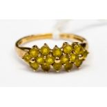A 9ct gold ring set with citrine stones in a three row lozenge shape, gross weight 2.