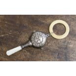 A child's rattle with mother of pearl handle, filled body, Sun with Face,