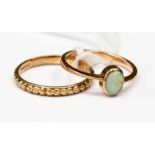 An opal 9ct rose gold ring, the bezel set opal measuring approx 6 by 4.