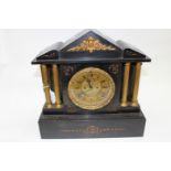 A Victorian slate clock with brass dial, painted numerals,