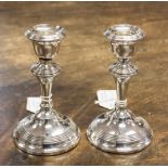 A pair of silver candlesticks, weighted bases, Birmingham 1919,