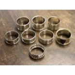 Six silver napkin rings, two with Chester hallmarks, with two others,