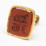 A yellow metal fob seal, with carnelian hardstone seal, with intarso Lioness and initial D.E.