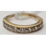 A nine stone diamond half eternity ring in 9ct yellow gold, total diamond weight approx 0.