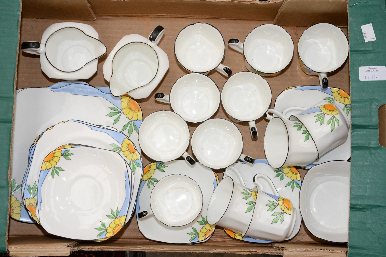 A fine china 1930s tea service comprising of twelve cups - saucers and tea plates, two milk jugs,