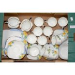 A fine china 1930s tea service comprising of twelve cups - saucers and tea plates, two milk jugs,