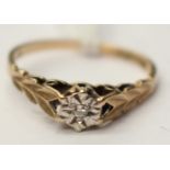 A single stone diamond ring, illusion set, possibly 9ct gold,