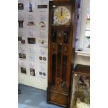 A George V oak Grandmother clock, silvered dial, gilt spandrels,