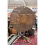 A George III oak tilt top tripod table,