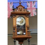 An early 20th Century walnut cased eight day Vienna wall clock with chapter dial (1)