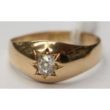 A gents diamond solitaire signet ring star set, with an old cut diamond approx 0.