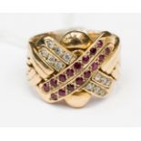 A ruby and diamond set 18ct gold band ring, 15.