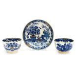An early Worcester blue and white tea bowl and saucer, together with another tea bowl,