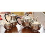 A George V silver boat-shape, four piece silver tea service,