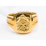 A gold signet ring unmarked, possibly 18-22ct gold, with an eagle detail, size V1/2,