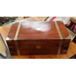 A mahogany writing slip brass bonding and secret compartment drawers