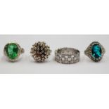 Four various dress rings, comprising a paraiba apatite dress ring, a green stone dress ring,
