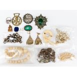 A collection of various costume jewellery, including ivory brooch, string of beads,