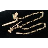 A 9ct gold chain with various fobs, tooth pick, etc,
