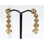 A pair of 18ct gold diamond drop earrings (2) Condition Report: XXXXXXXXX