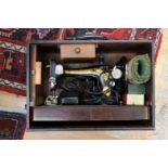A late 19th Century Singer sewing machine, boxed,
