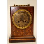 A rosewood and satinwood inlaid carriage clock, silvered dial,