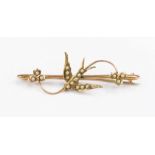 A 9ct gold and seed pearl Swallow bar brooch